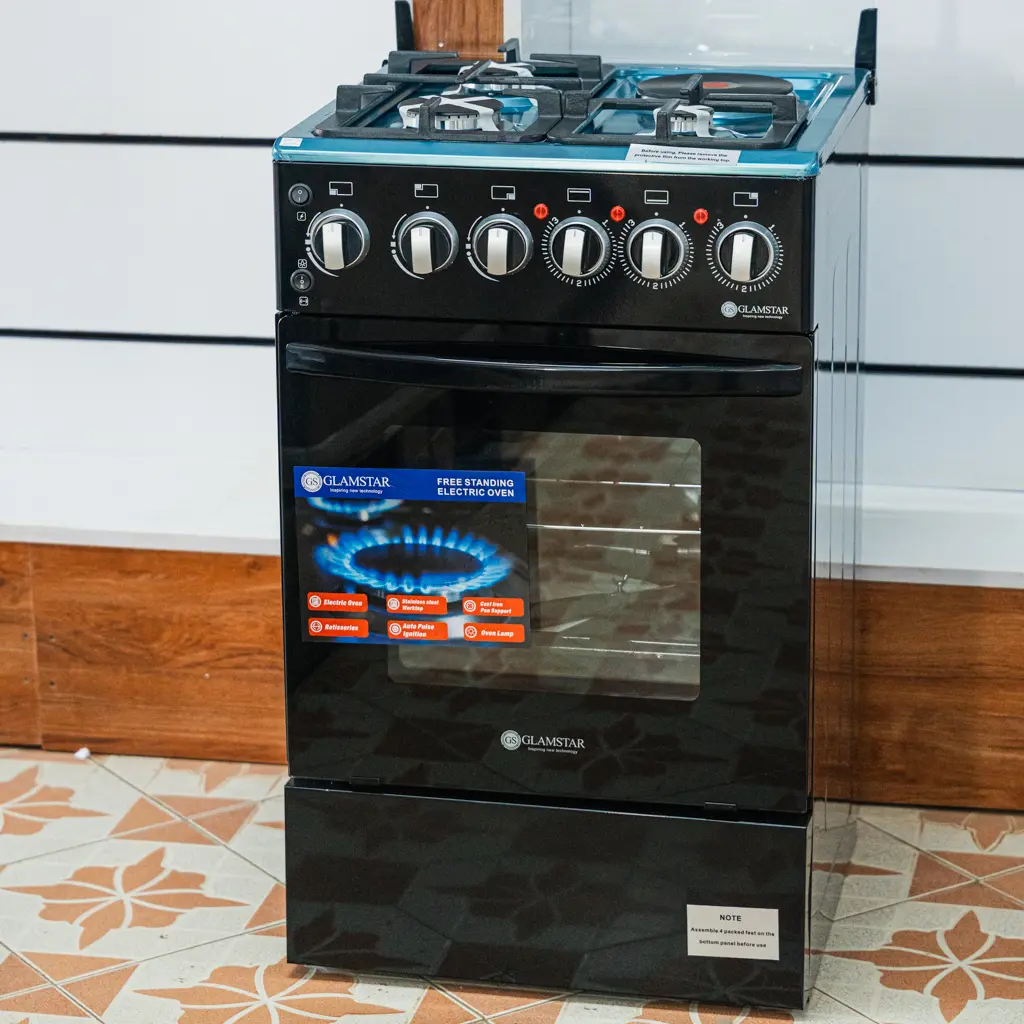 Glamstar Cooker 50x50 3 Gas 1 Electric Black 5 Glamstar 50x50 black standing cooker with glass lid raised and storage drawer at Tael Appliances.