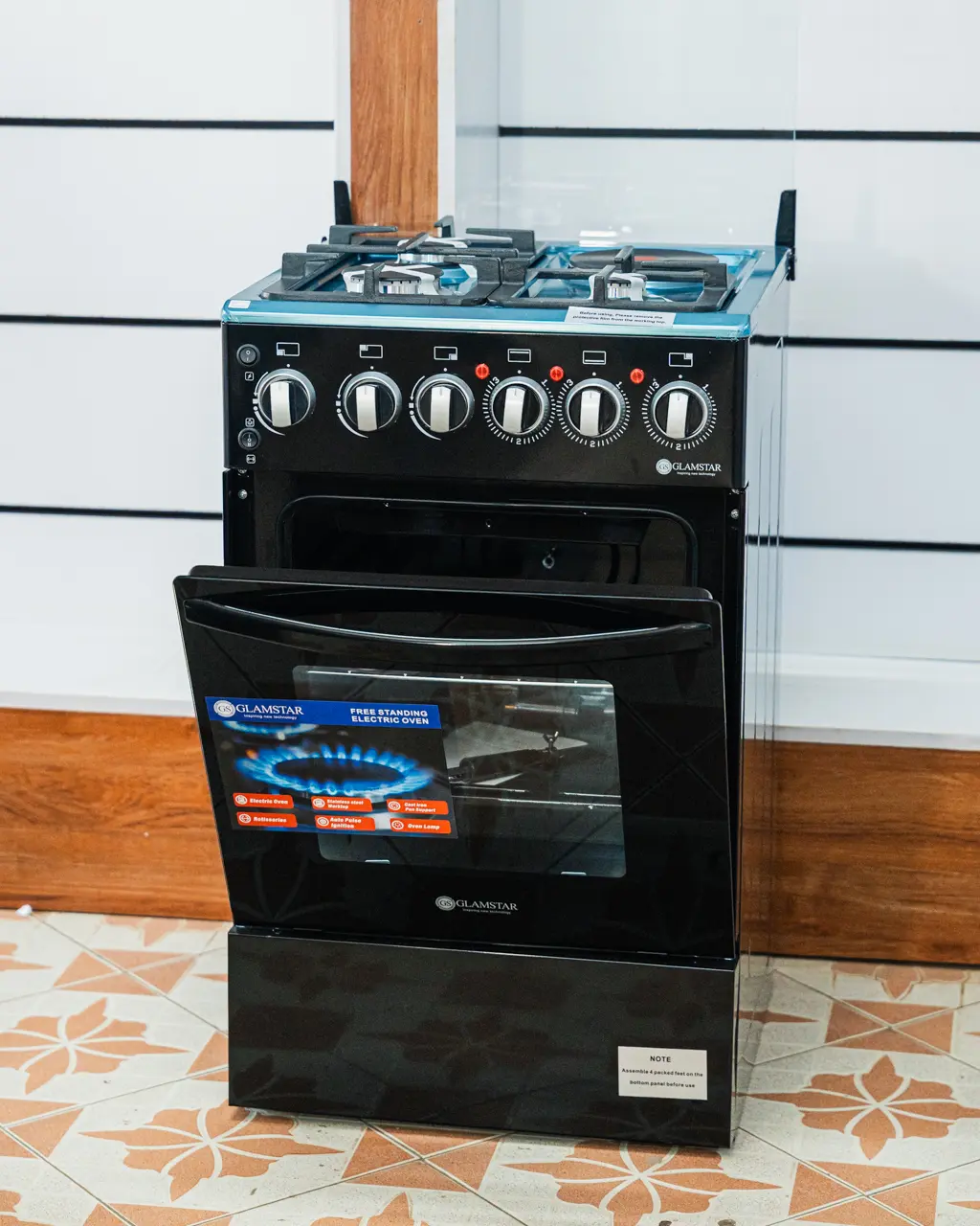 Glamstar Cooker 50x50 3 Gas 1 Electric Black 3 Glamstar 50x50 cooker with the oven door open, showing the oven shelf and rotisserie at Tael Appliances.
