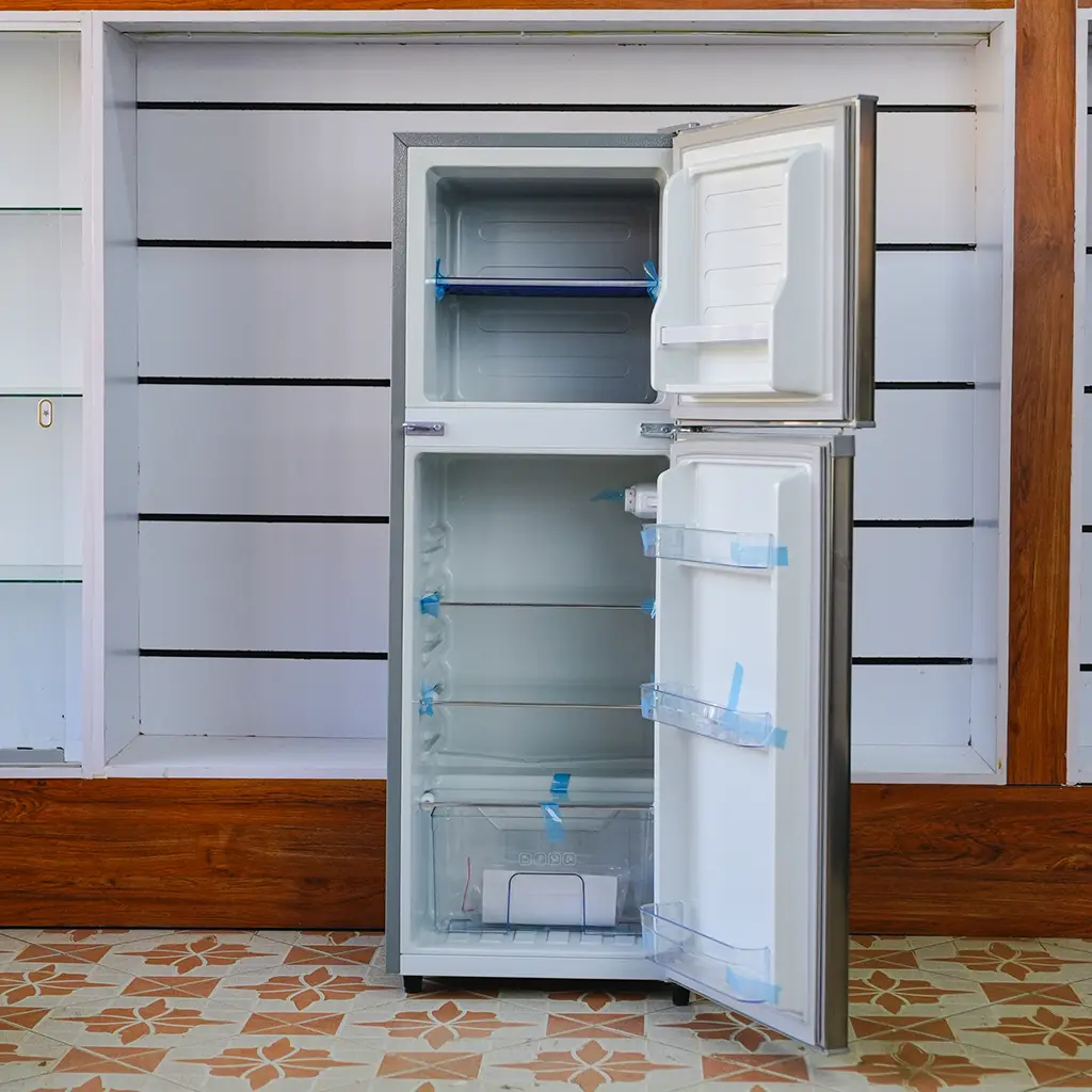 Ramtons Fridge 128Ltrs 4 Ramtons Fridge 128Ltrs RF/177 128L double door refrigerator in Titan Steel finish – Features Direct Cool technology, transparent glass shelves, 120W power rating, freezer door compartment, and CFC-free operation. Compact and energy-efficient design ideal for small kitchens and offices. Available now at Tael Appliances.