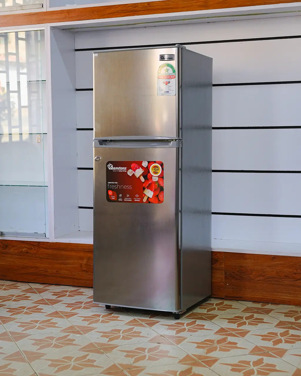 Ramtons Fridge 128Ltrs 5 Ramtons Fridge 128Ltrs RF/177 128L double door refrigerator in Titan Steel finish – Features Direct Cool technology, transparent glass shelves, 120W power rating, freezer door compartment, and CFC-free operation. Compact and energy-efficient design ideal for small kitchens and offices. Available now at Tael Appliances.