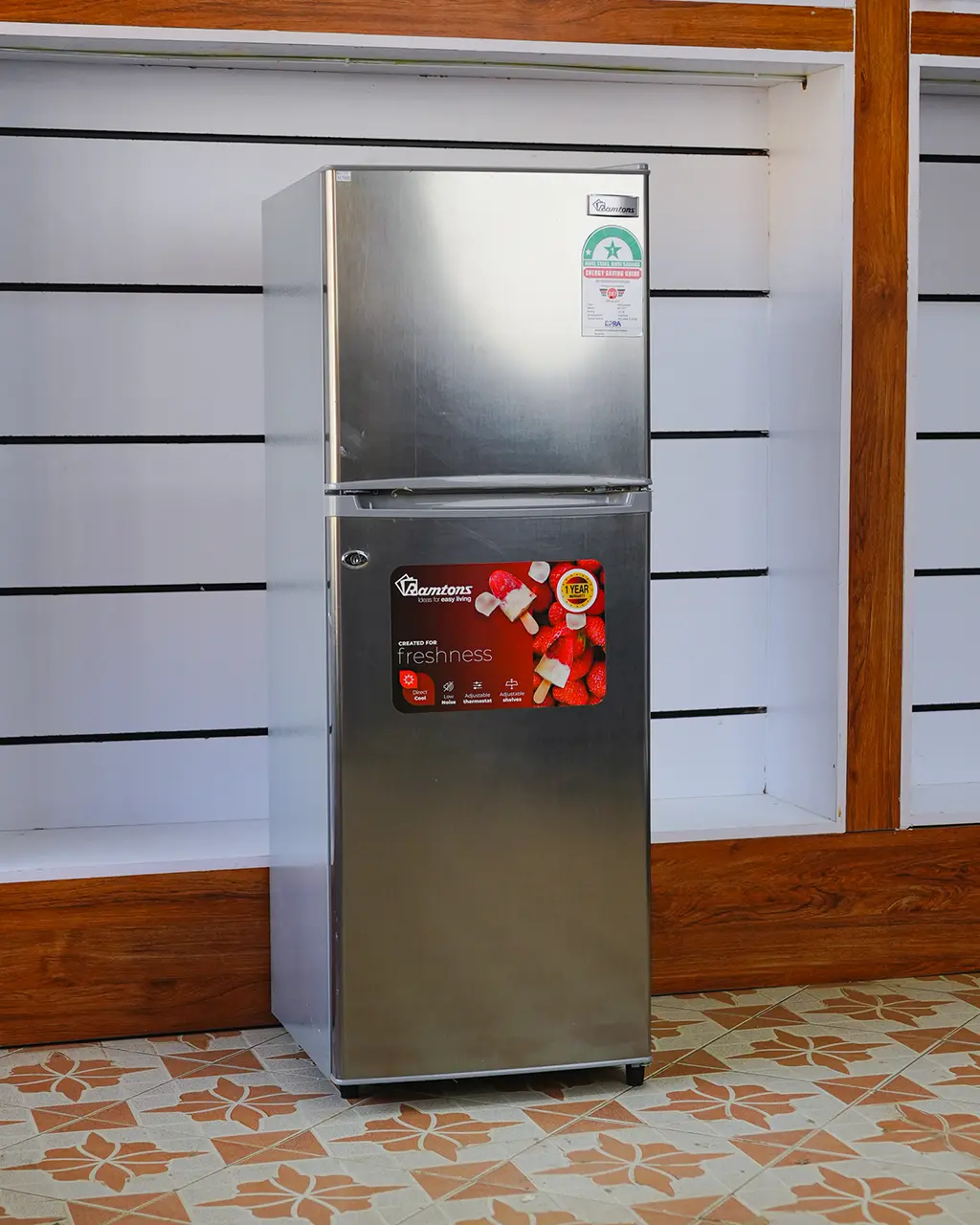 Ramtons Fridge 128Ltrs 2 Ramtons Fridge 128Ltrs RF/177 128L double door refrigerator in Titan Steel finish – Features Direct Cool technology, transparent glass shelves, 120W power rating, freezer door compartment, and CFC-free operation. Compact and energy-efficient design ideal for small kitchens and offices. Available now at Tael Appliances.