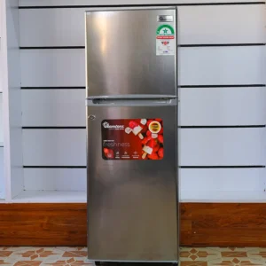 Ramtons Fridge 128Ltrs RF/177 128L double door refrigerator in Titan Steel finish – Features Direct Cool technology, transparent glass shelves, 120W power rating, freezer door compartment, and CFC-free operation. Compact and energy-efficient design ideal for small kitchens and offices. Available now at Tael Appliances.