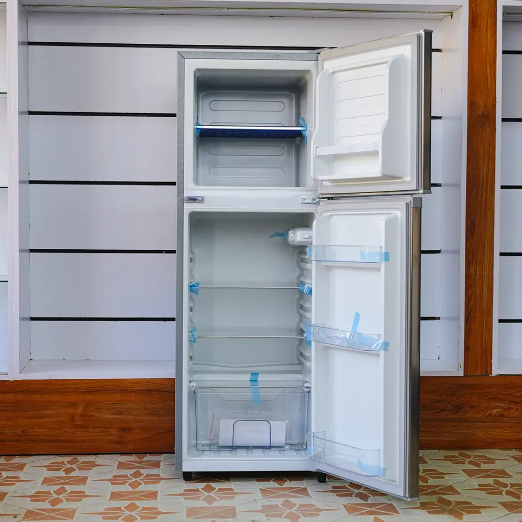Ramtons Fridge 128Ltrs 3 Ramtons Fridge 128Ltrs RF/177 128L double door refrigerator in Titan Steel finish – Features Direct Cool technology, transparent glass shelves, 120W power rating, freezer door compartment, and CFC-free operation. Compact and energy-efficient design ideal for small kitchens and offices. Available now at Tael Appliances.