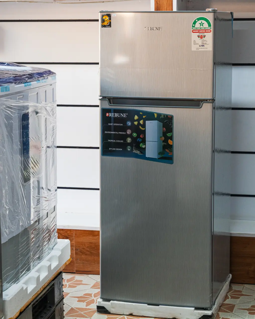 Rebune Fridge 208Ltrs Double Door Silver 4 Rebune 208Ltrs silver double door fridge, front-right showroom view at Tael Appliances.