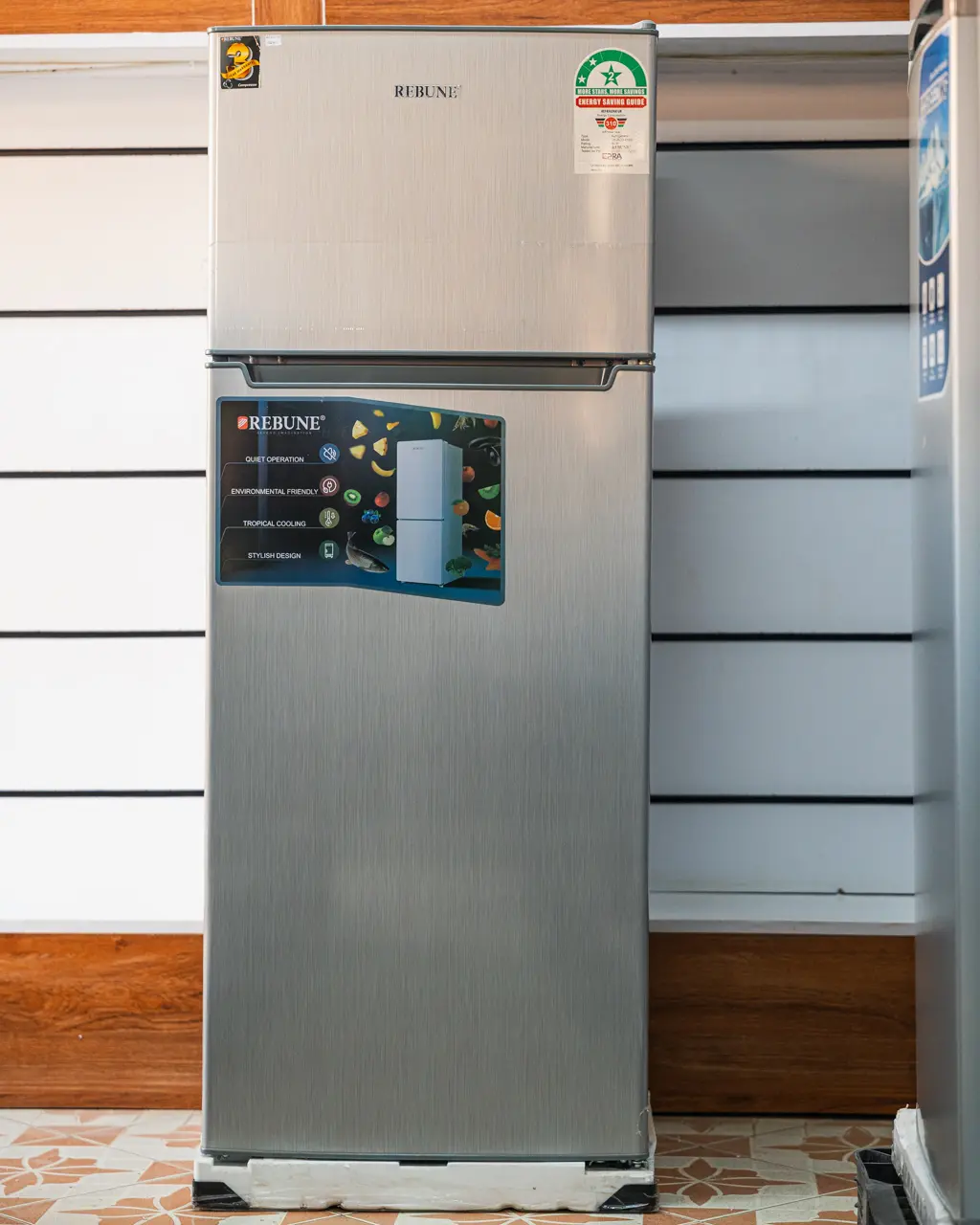 Rebune Fridge 208Ltrs Double Door Silver 1 Rebune 208Ltrs double door fridge in brushed silver with top-mount freezer at Tael Appliances.
