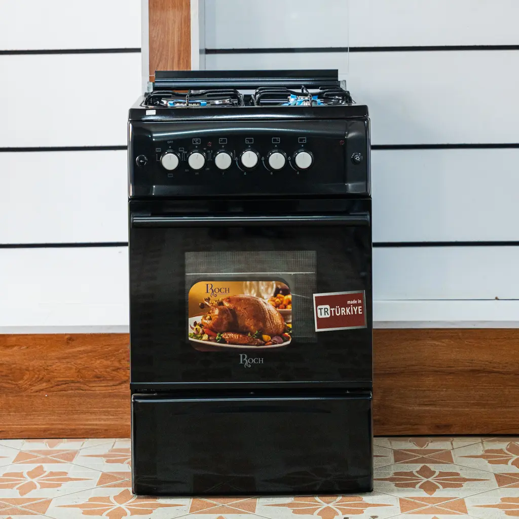 Roch Cooker 50x55 3 Gas 1 Electric Black 4 Roch 50x55 black standing cooker, front view with the glass lid raised at TAEL Electronics and Appliances.