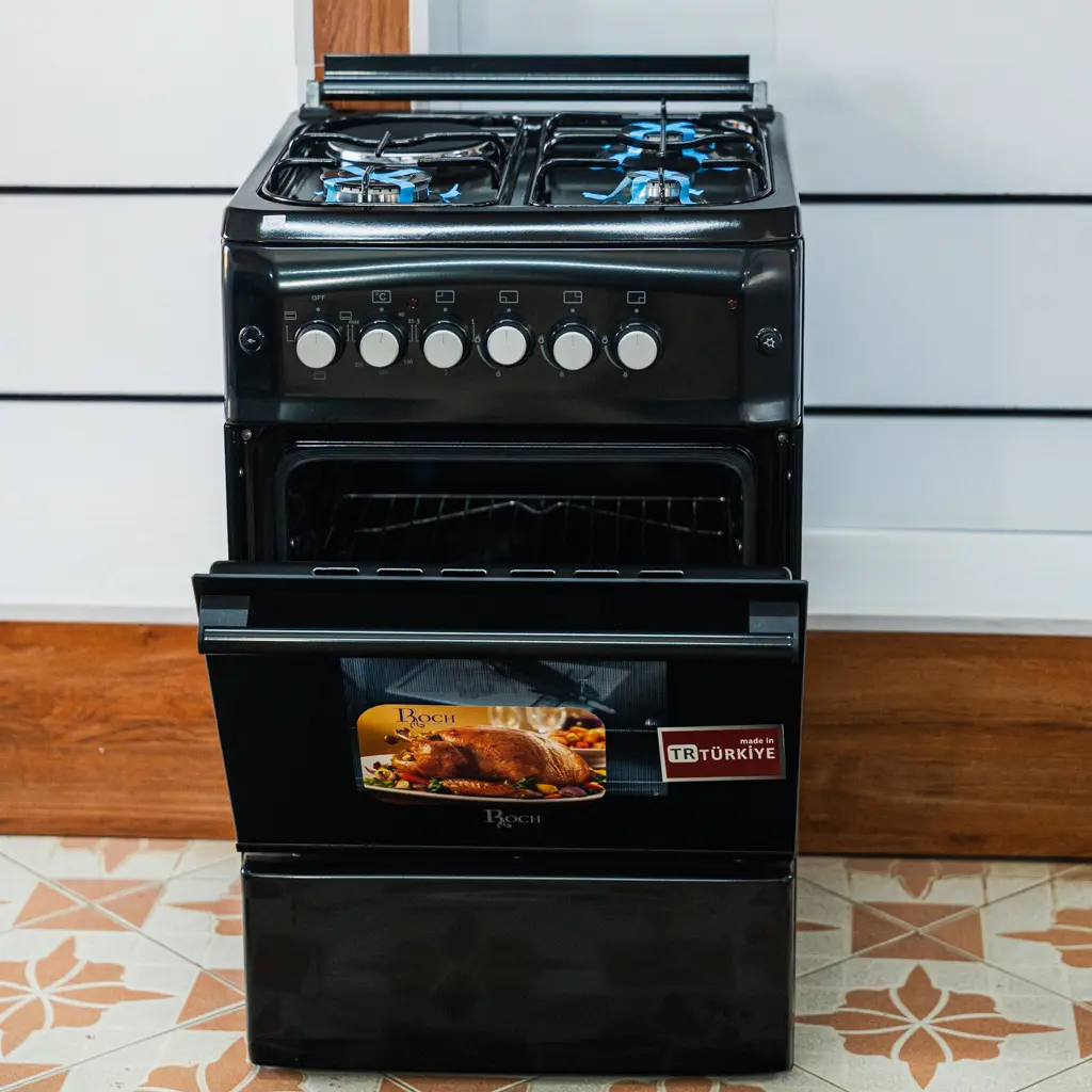 Roch Cooker 50x55 3 Gas 1 Electric Black 3 Roch 50x55 cooker with the oven door open, showing the oven shelf and cavity at TAEL Electronics and Appliances.