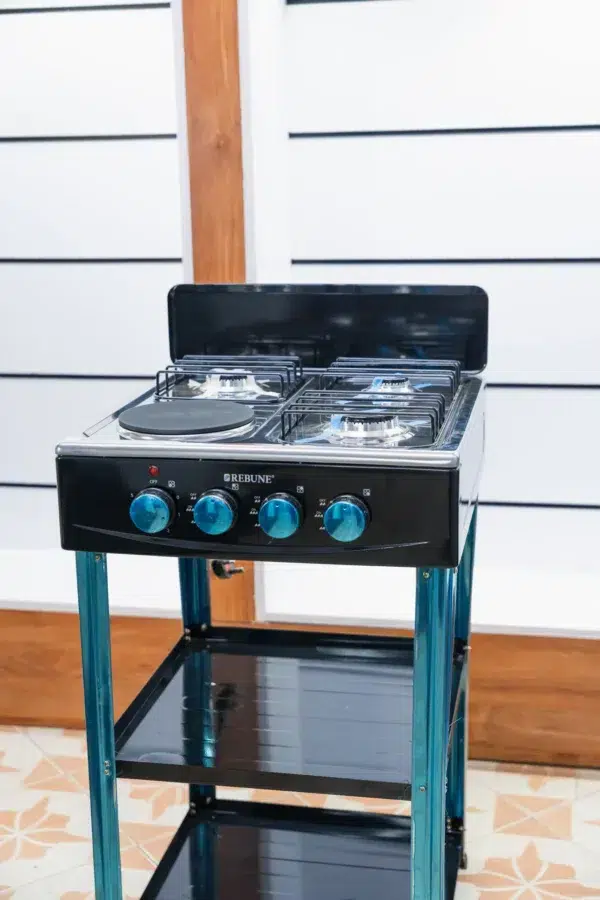 Rebune 50x50 standing cooker with three gas burners, an electric hotplate and two shelves at Tael Appliances.