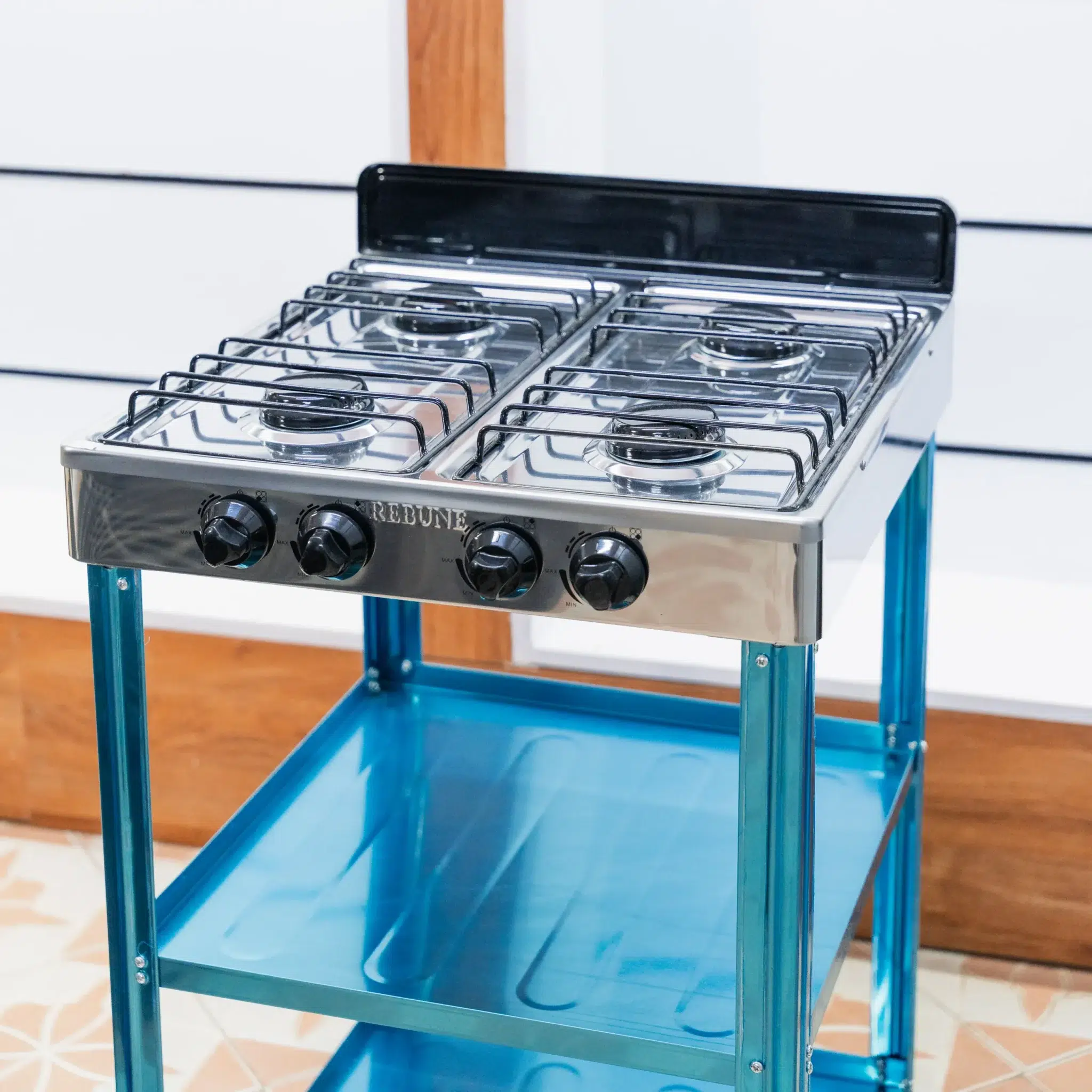 Rebune 4 Burner Gas Cooker 50x50 with Storage Shelves 3 Rebune 4 burner gas cooker hob from above, showing four burners and the MAX to MIN knobs at Tael Appliances.
