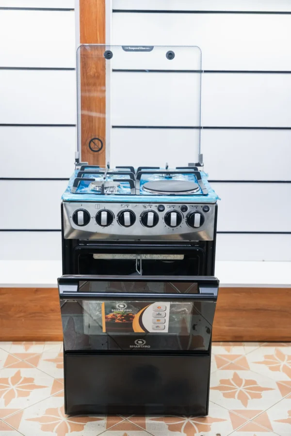 Smart Pro 50x50 standing cooker in black with stainless control panel and tempered glass lid at Tael Appliances.